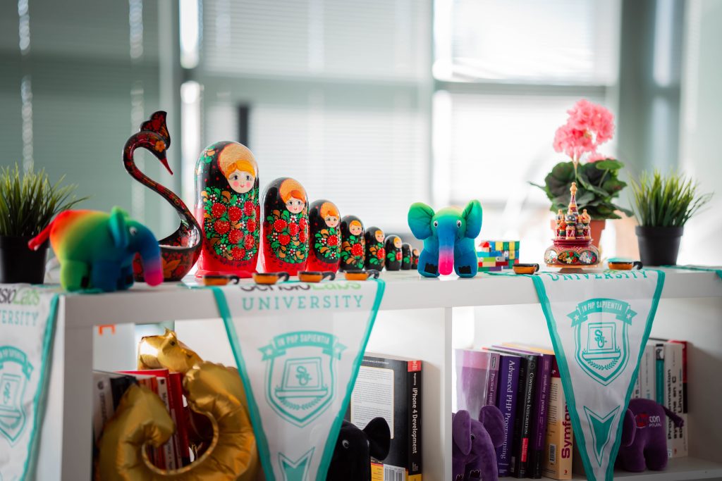 Shelves at the SensioLabs office with elephpants and pennants