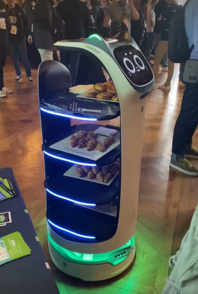 photo of a robot with pastries 