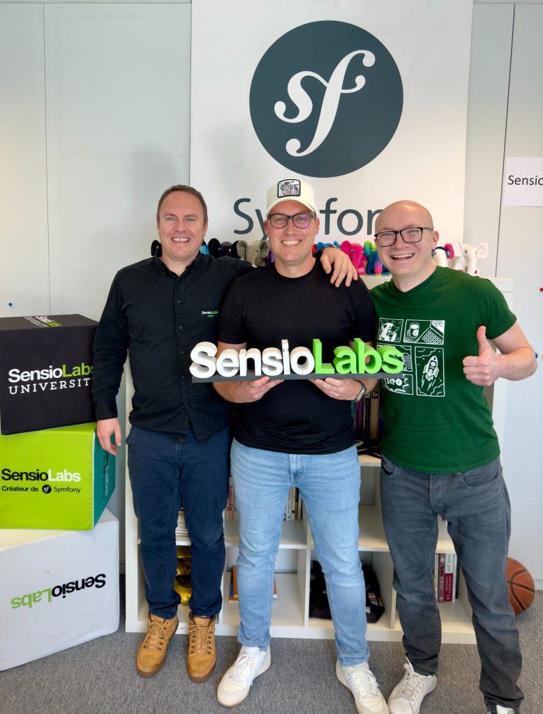 Ludovic Duval, Oskar Stark, and Jaromir Focjik smiling and holding the SensioLabs logo